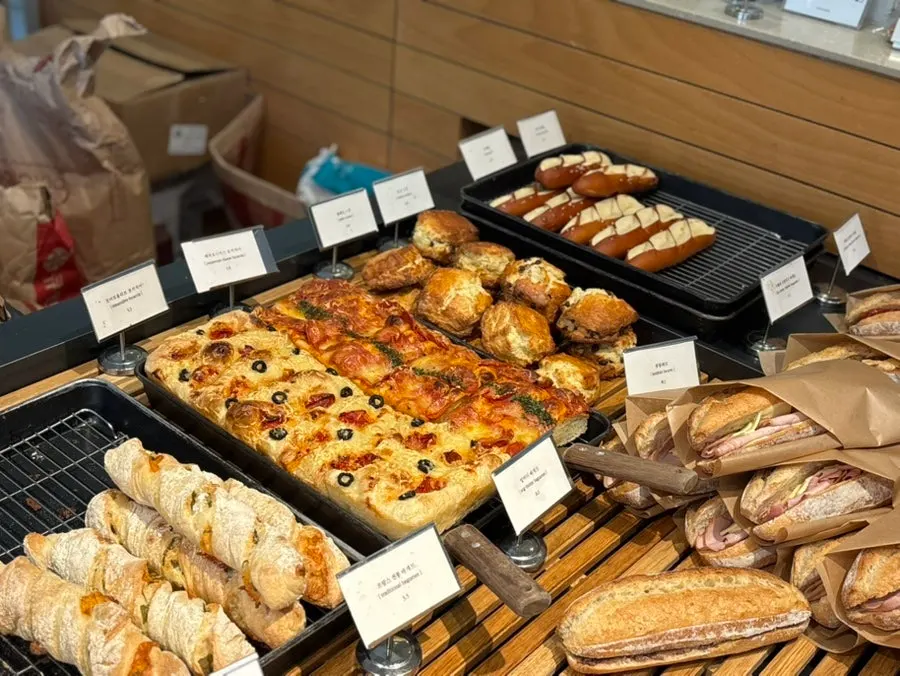 Display case with sandwiches and brunch breads