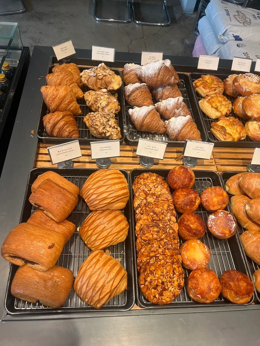 Bread display case with salt bread and croissants