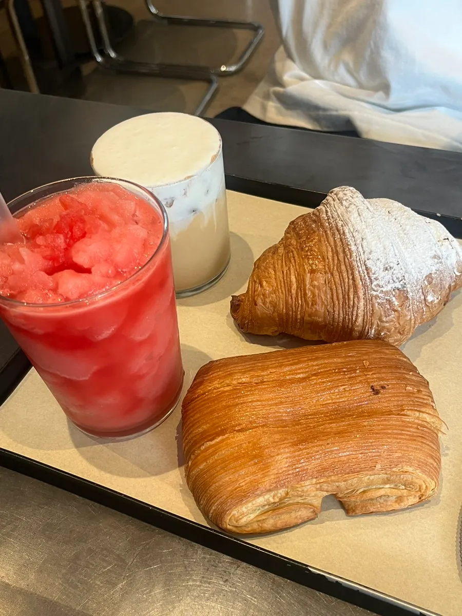 Table with watermelon juice ttaengmoban and bakery items
