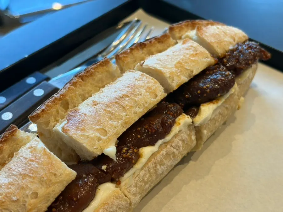 Cross-section of the baguette with butter and stewed fig