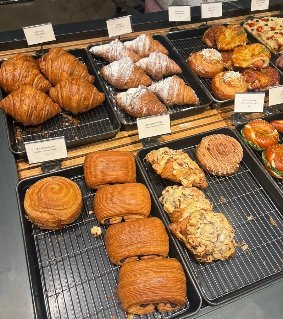 Bakery items displayed on shelves at Degree Gojan Branch