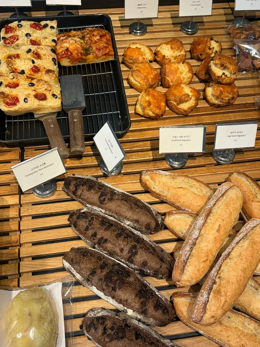 Bread display case with croissants and pastries