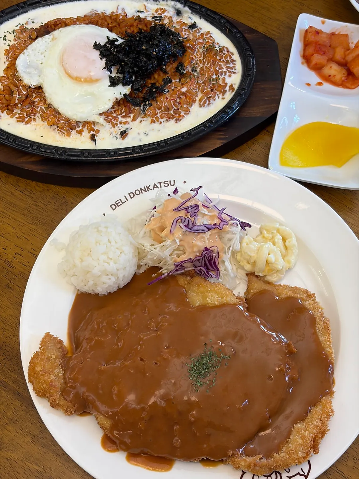 Table set with both pork cutlet and kimchi fried rice