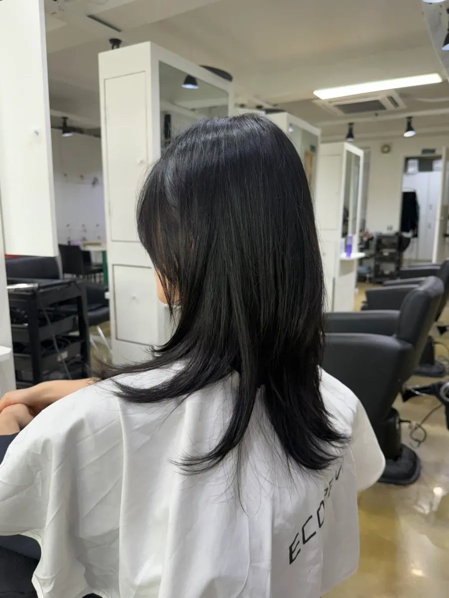 Neatly styled layered cut after treatment