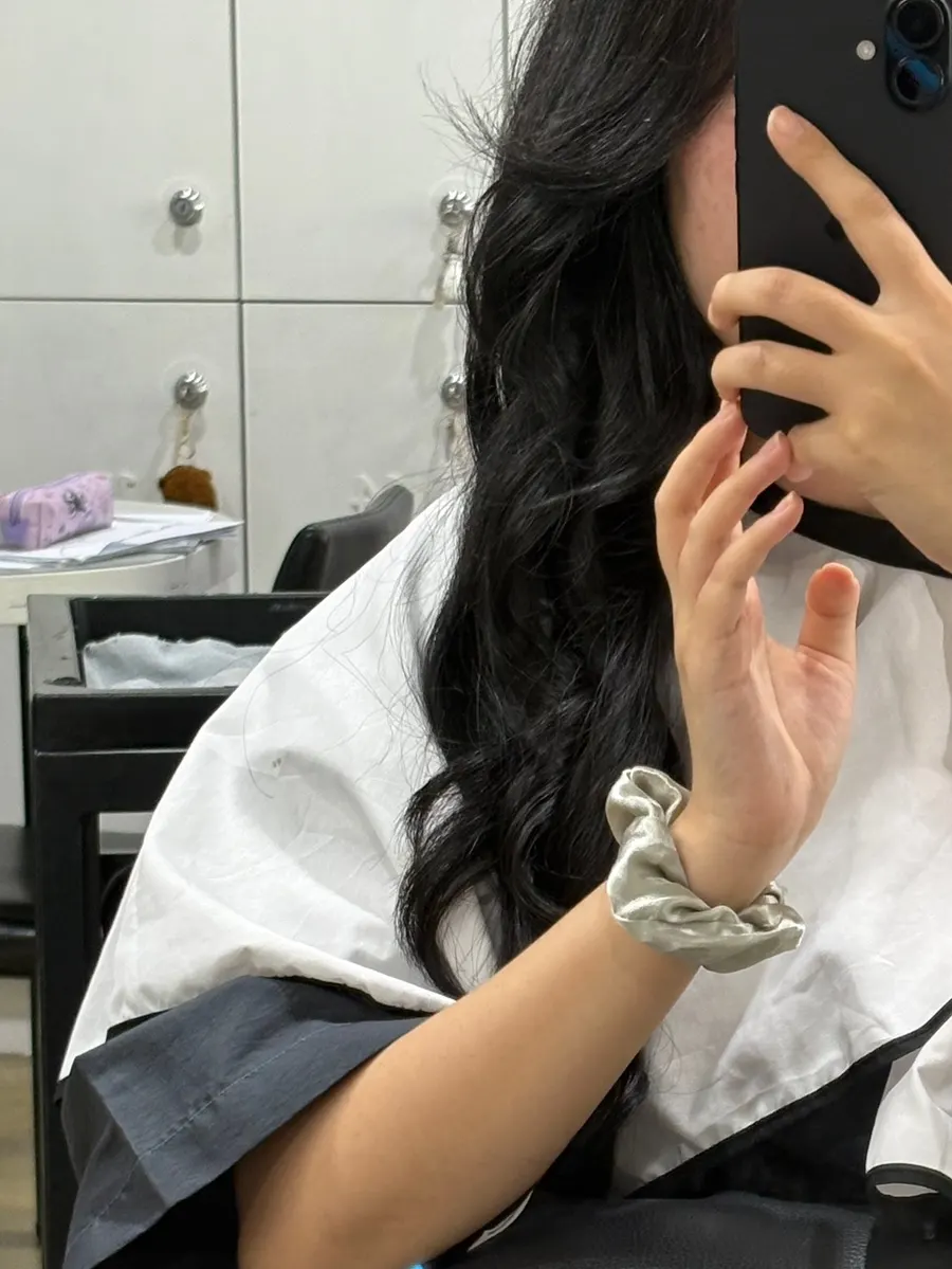 Silver brown hair showing reflective tones depending on angle