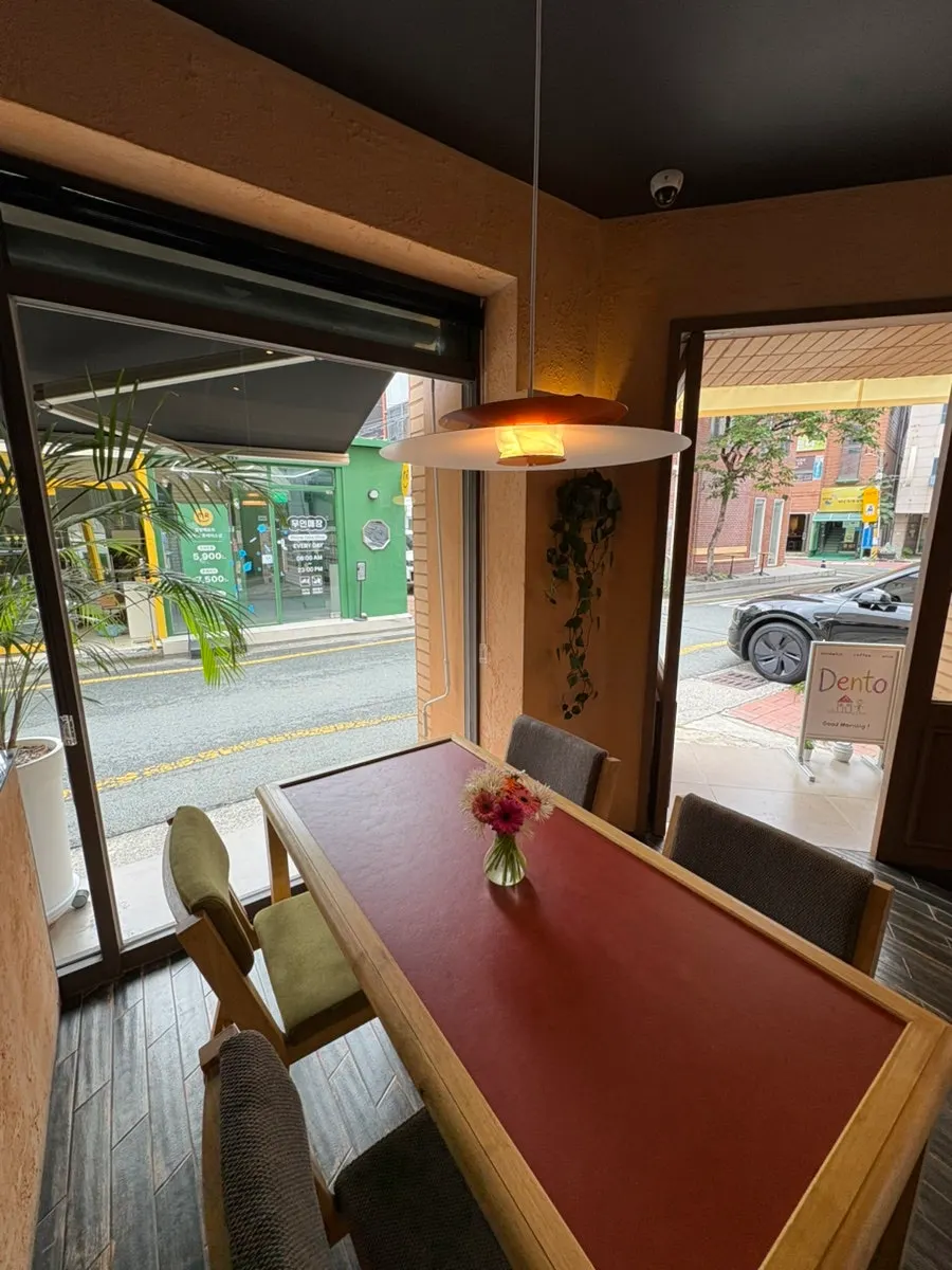 Seating at Dento with red tables and chairs