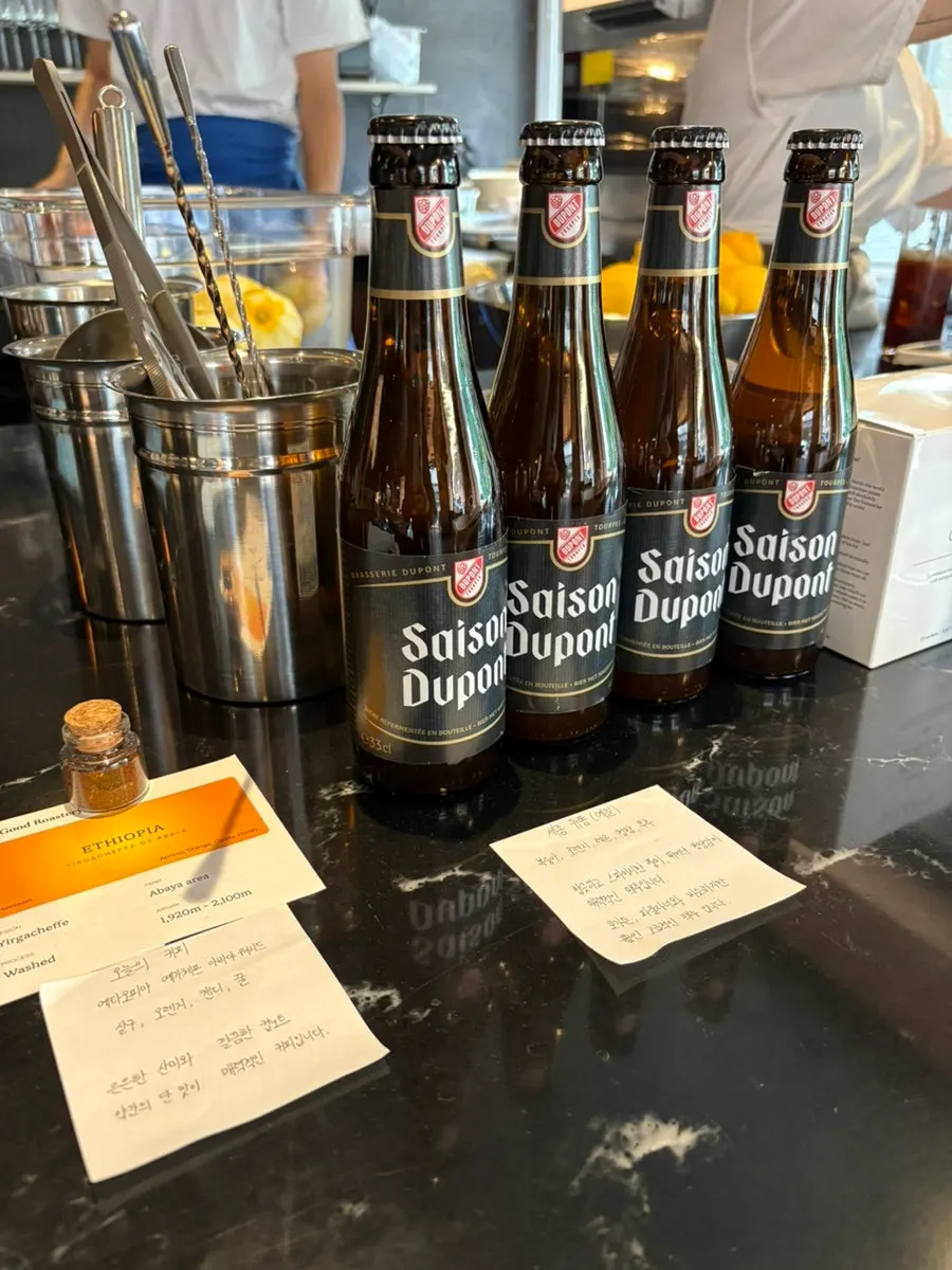 Bottled beer and house wine displayed at Dento's self-bar
