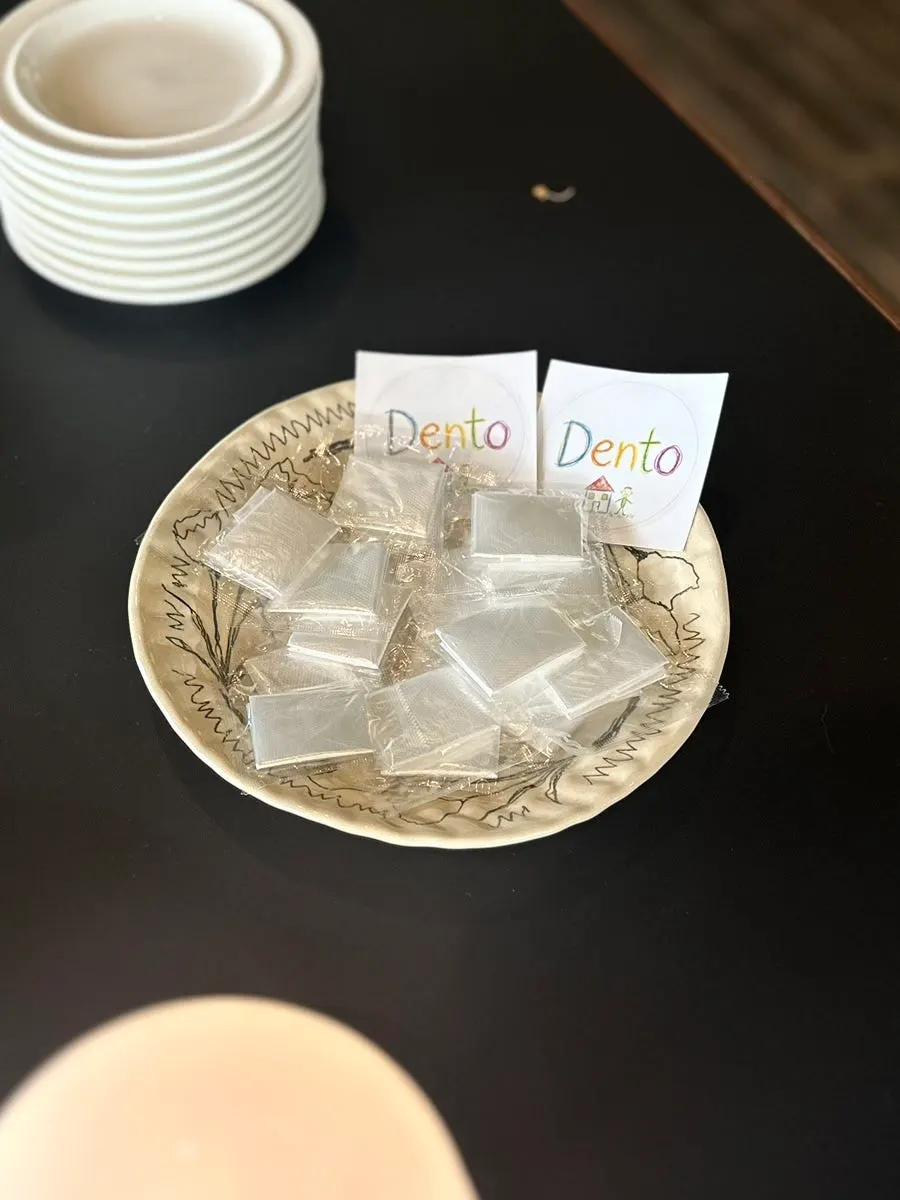 Tableware, wet wipes, and disposable plastic gloves at the self-serve bar