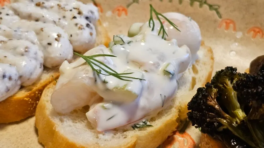 Shrimp rémoulade sandwich topped with whole shrimp