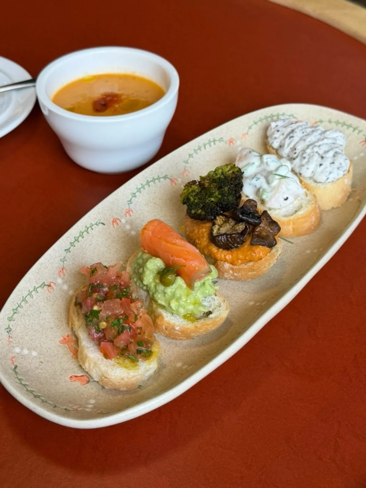 A plate of Dento's five bite-size open sandwiches
