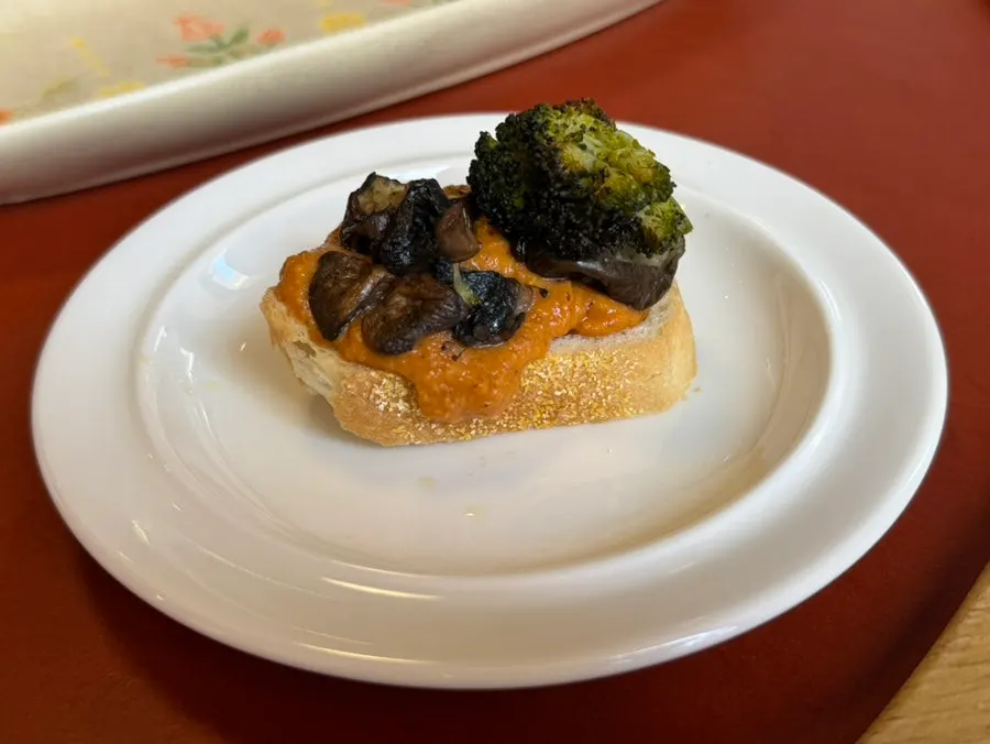 Open sandwich with roasted vegetables on romesco sauce
