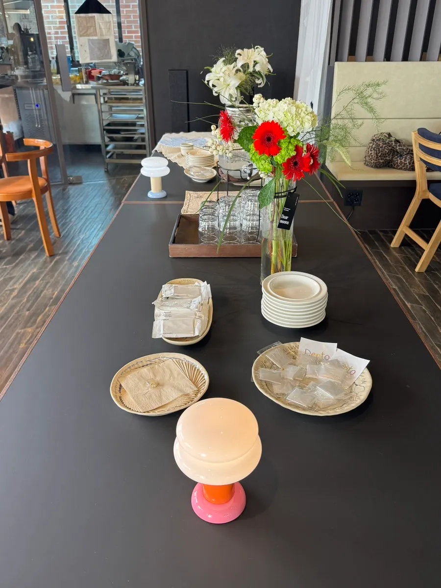 Side plates, disposable gloves, and water prepared at the table