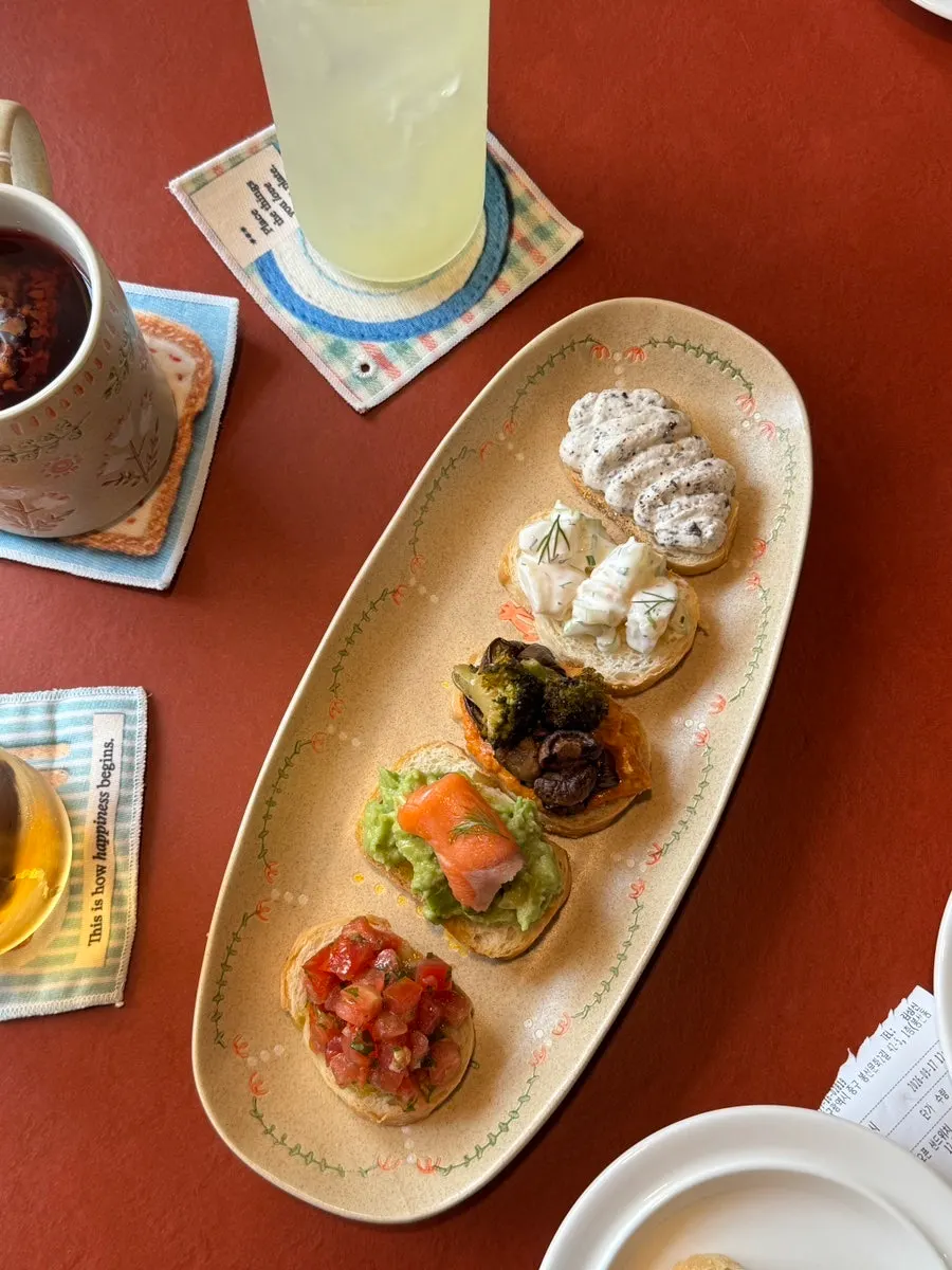 All 5 open sandwiches on a single plate