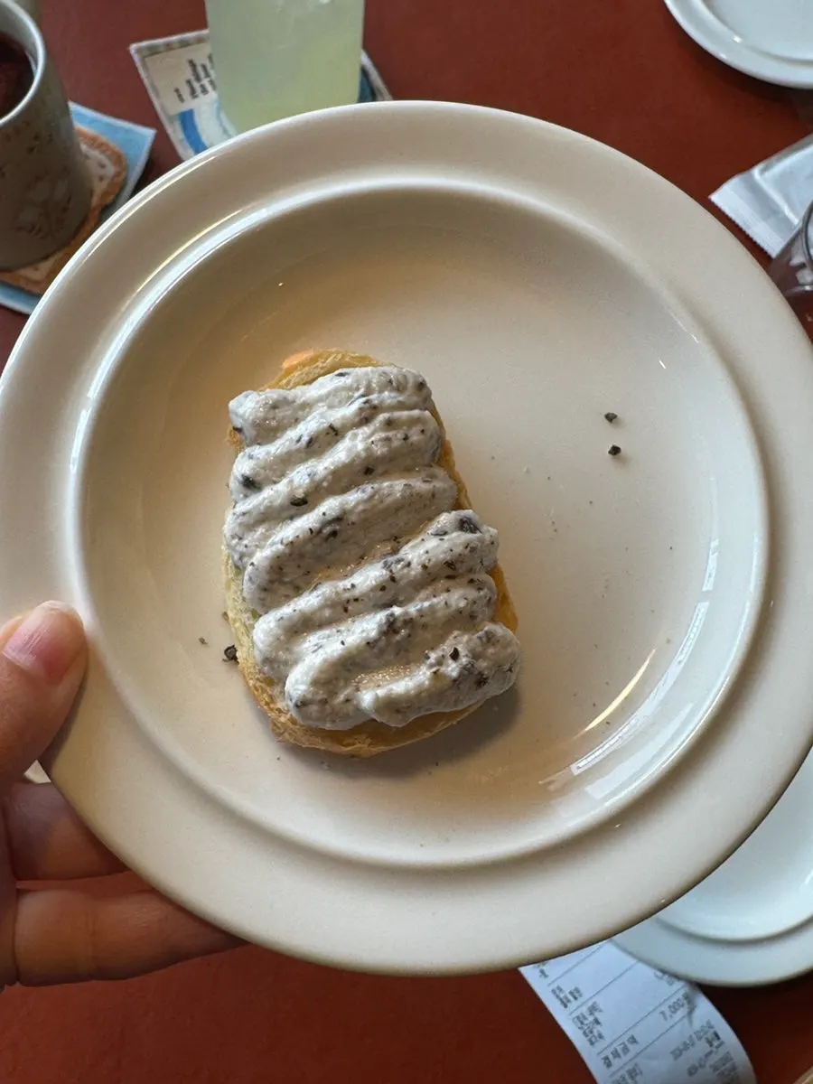 Open sandwich topped with truffle ricotta