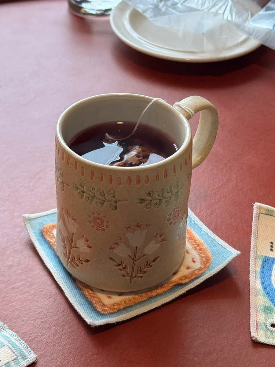 A cup of Dento's Crimson Punch Tea