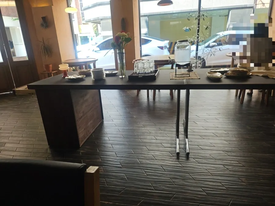 Sunlit table seating inside Dento