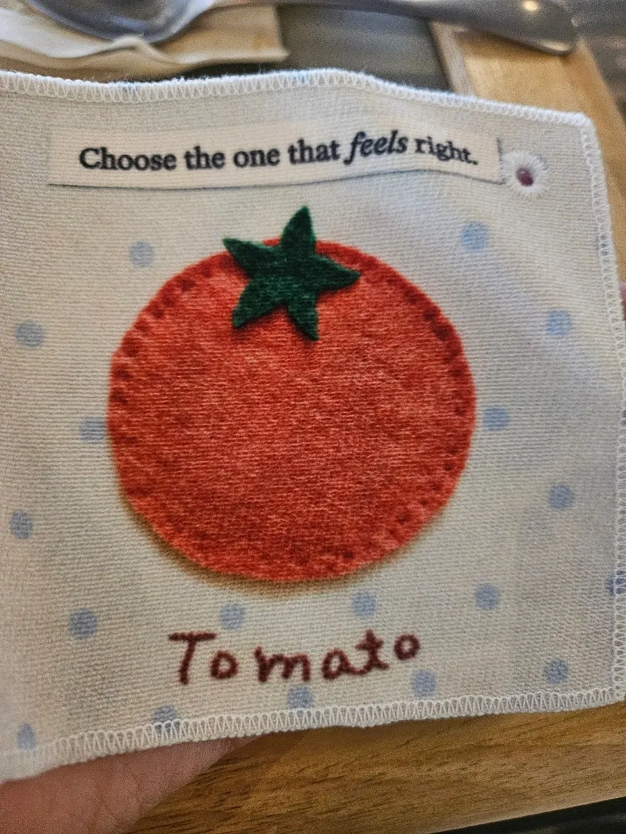 Tomato embroidery coaster served with the drink