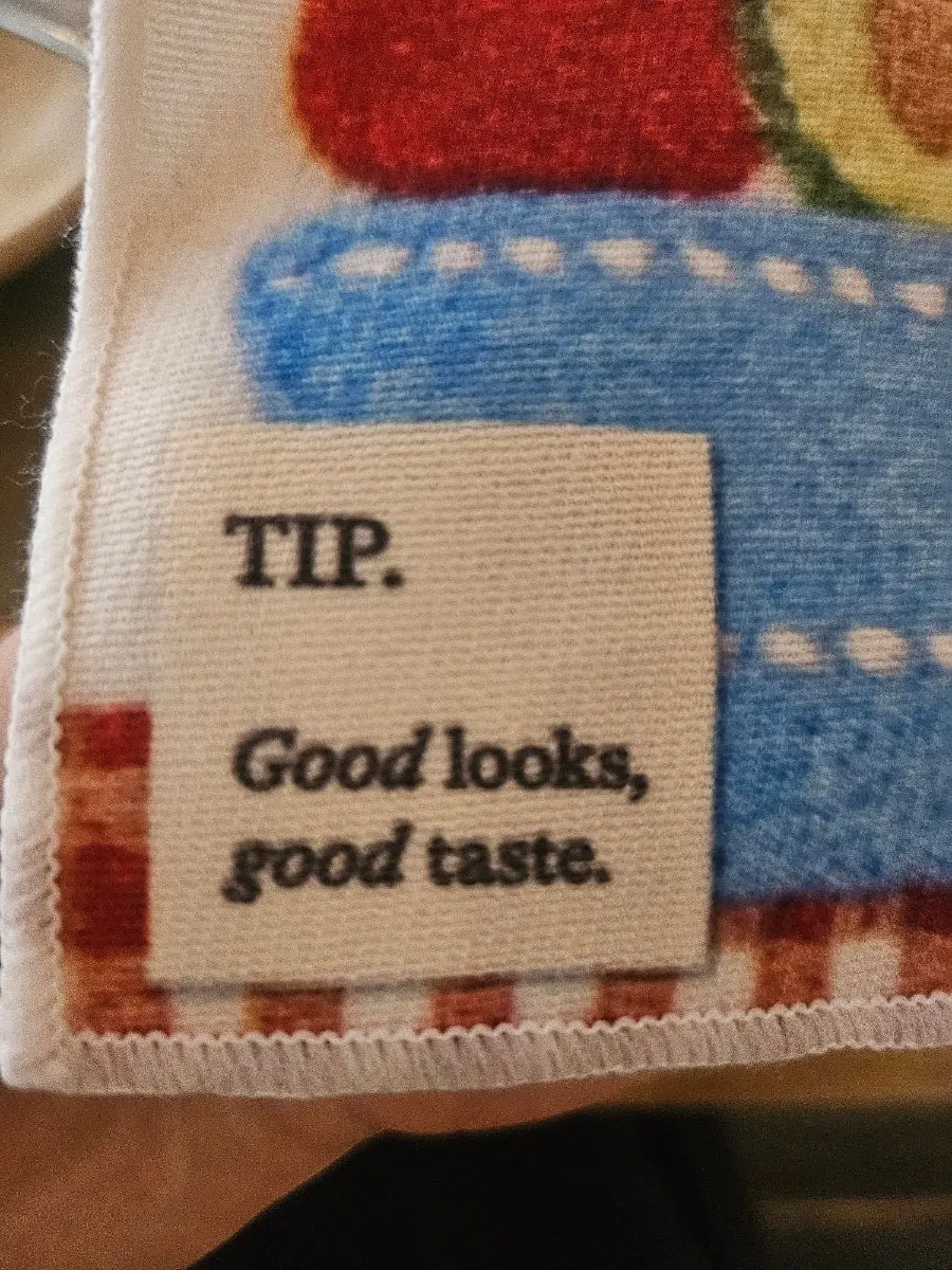 Dento's tomato fabric piece and printed phrase