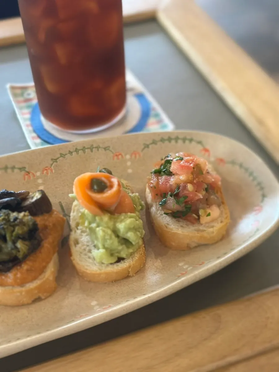 Bite-size sandwiches arranged in course order