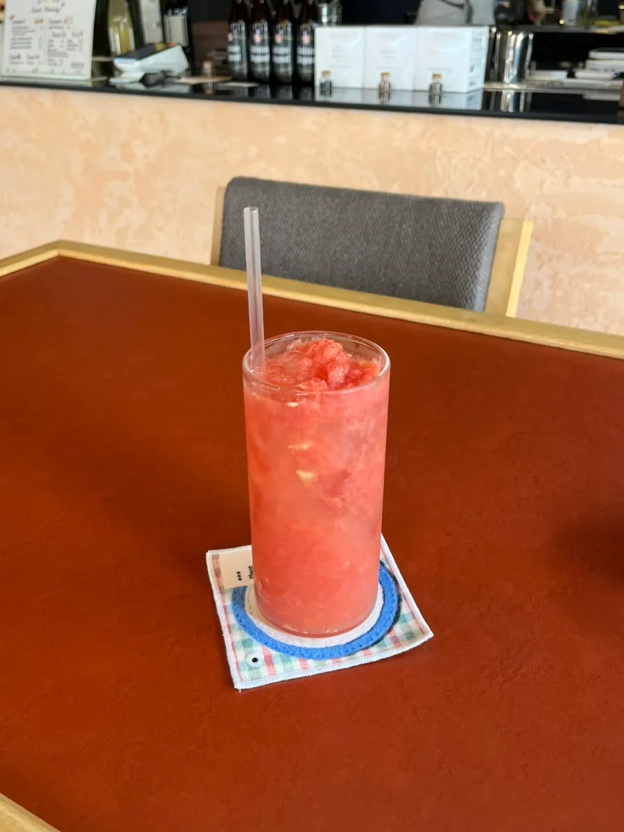 A glass of Dento's 100% grapefruit juice