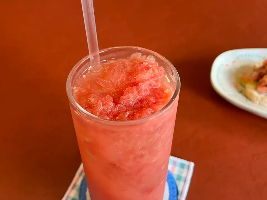 Close-up of grapefruit juice topped with grapefruit pulp