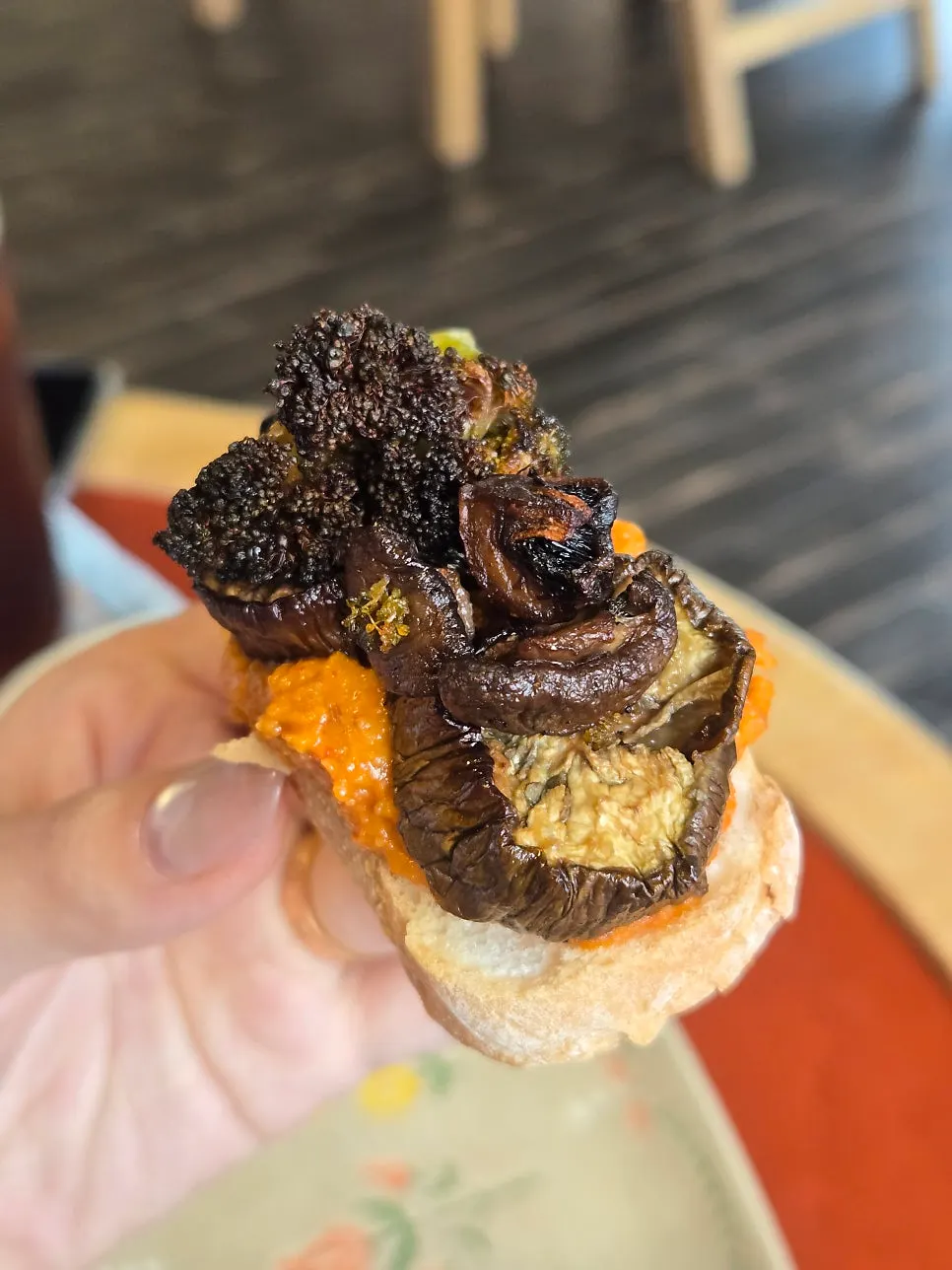 Open sandwich topped with eggplant and broccoli