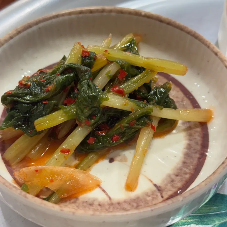Young radish kimchi served alongside the spicy stir-fry