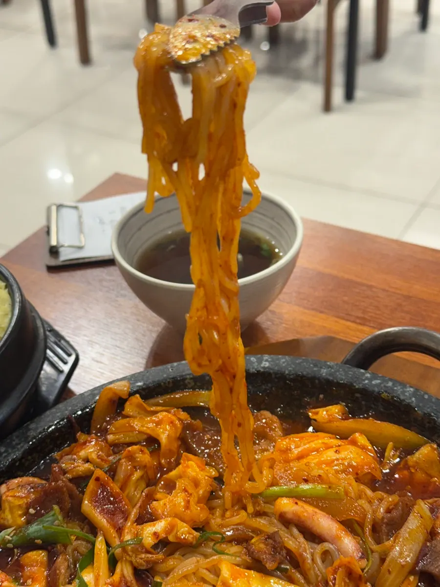 Chewy noodles mixed in inside the oje bokkeum