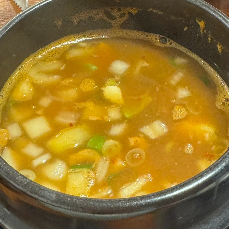 Oje bokkeum loaded onto a perilla leaf