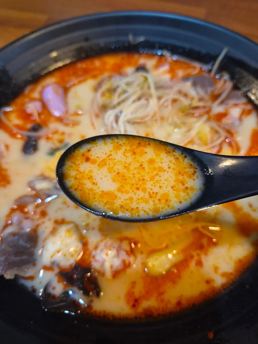 Picking up ingredients from the mala tang bowl