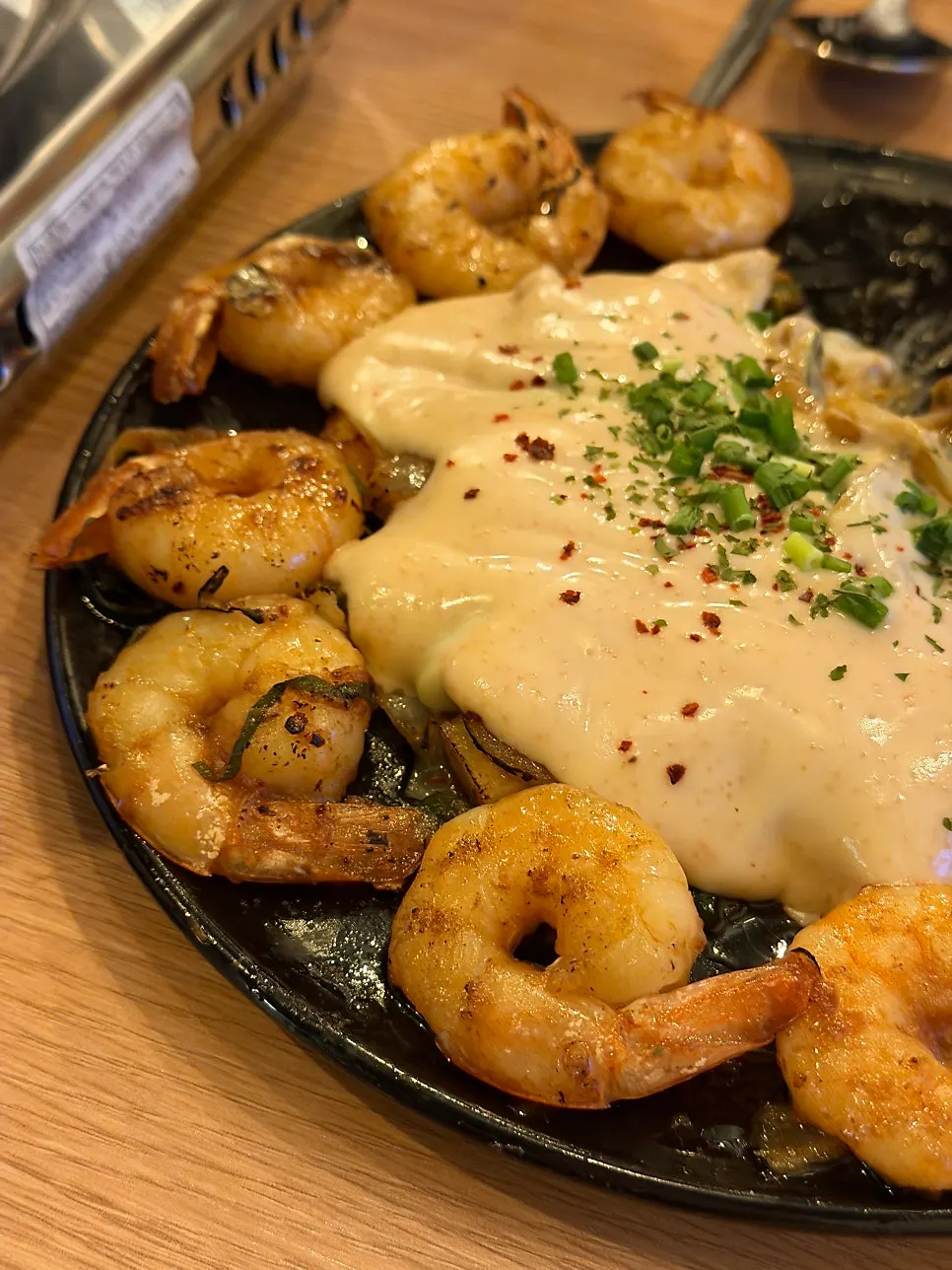 A plate of myeongran mayo shrimp stir-fry