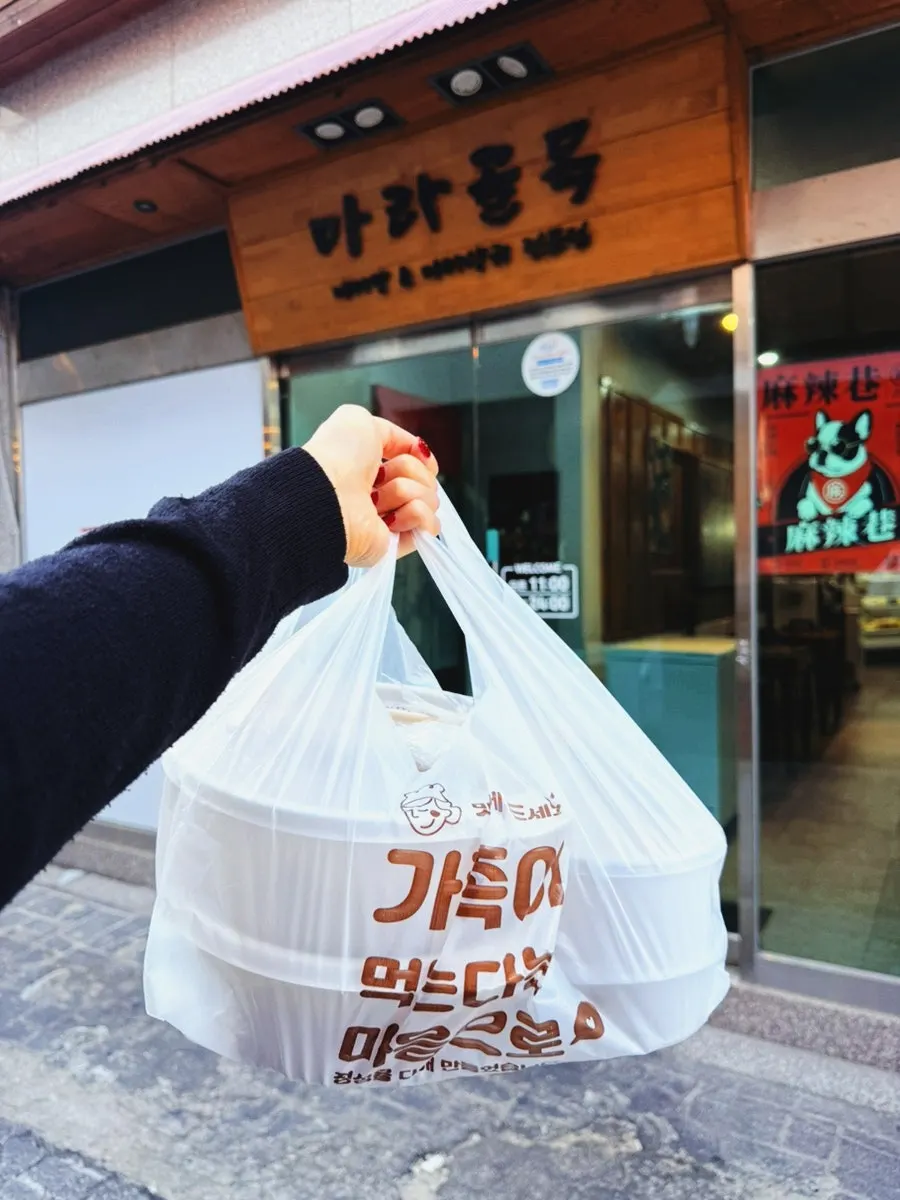Takeout food in a handled bag