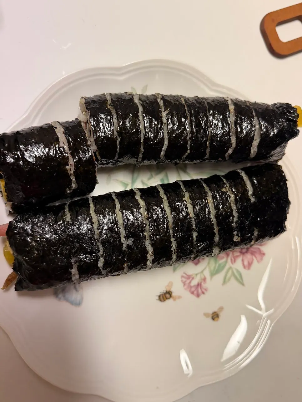 Gimbap dipped in tteokbokki sauce