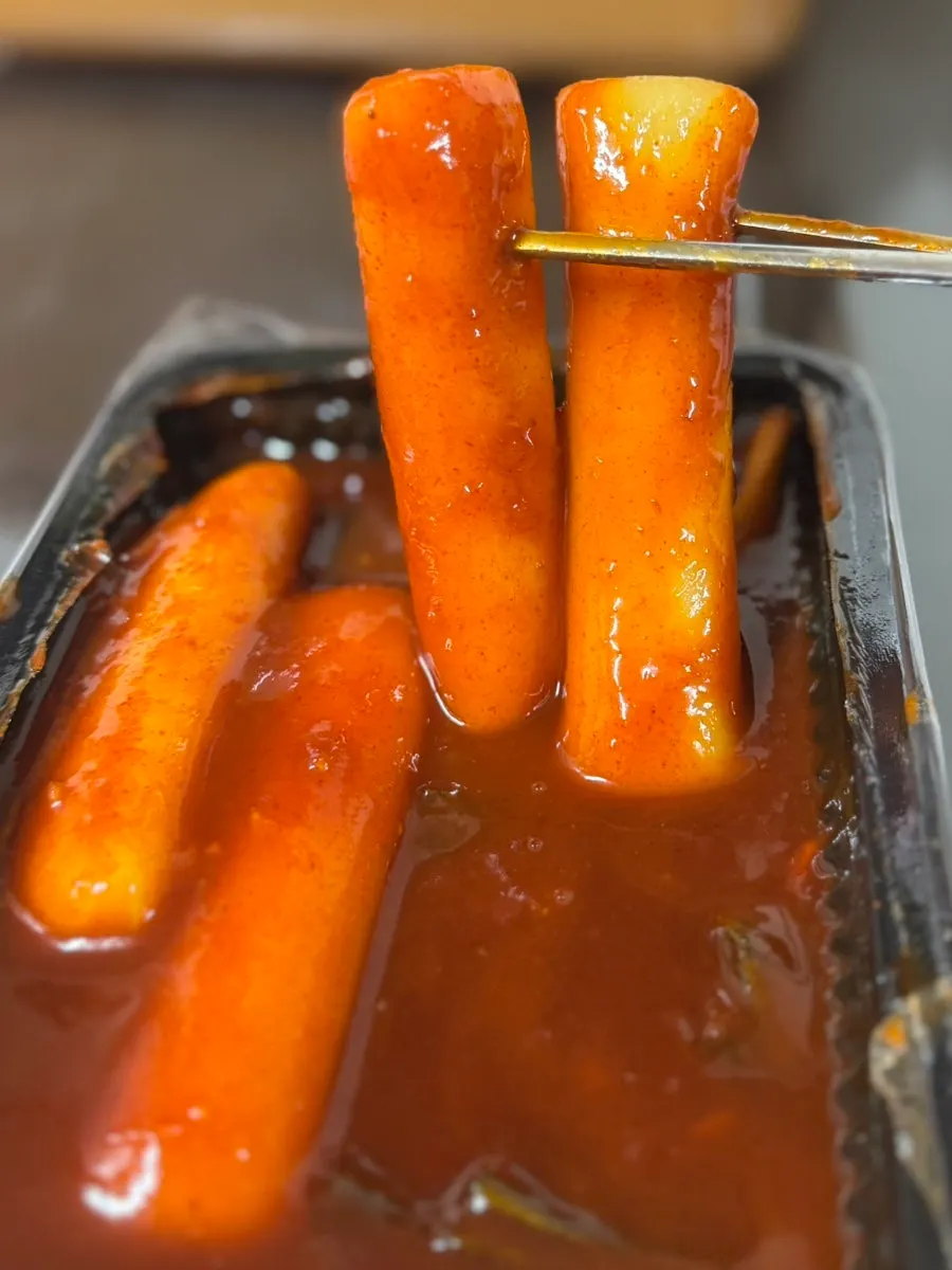 Close-up of tteokbokki with thick eomuk and green onion