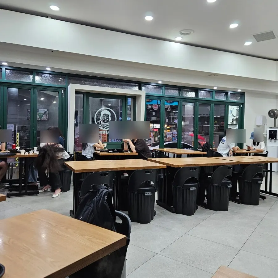 Interior with a large menu board on the wall