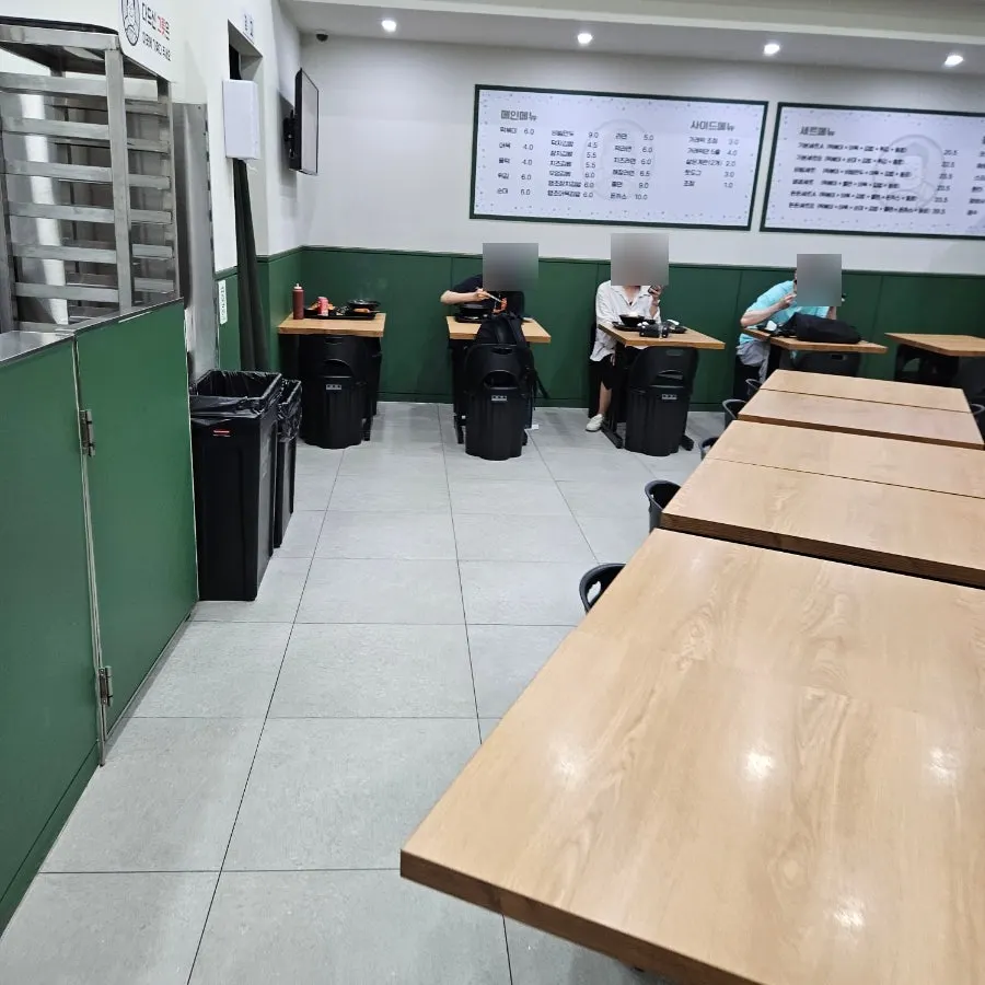 Widely spaced tables under bright lighting