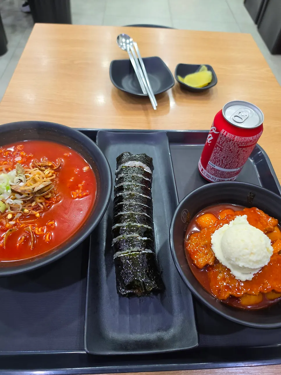 A snack spread including flat mandu and seasoned vegetables