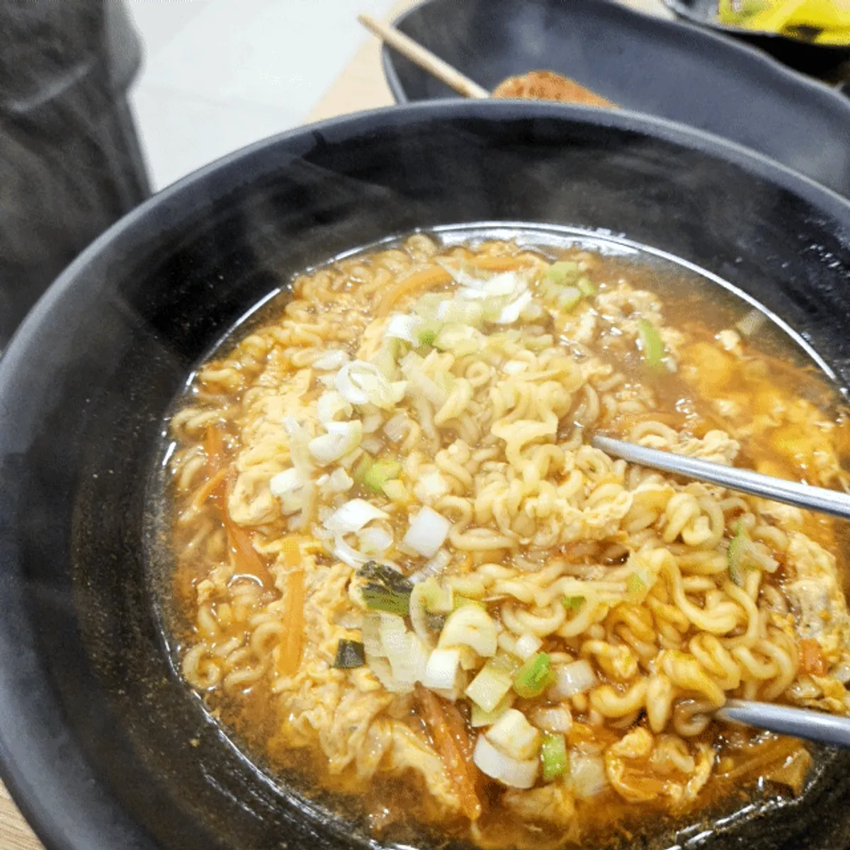 Curly noodles in steaming ramyeon