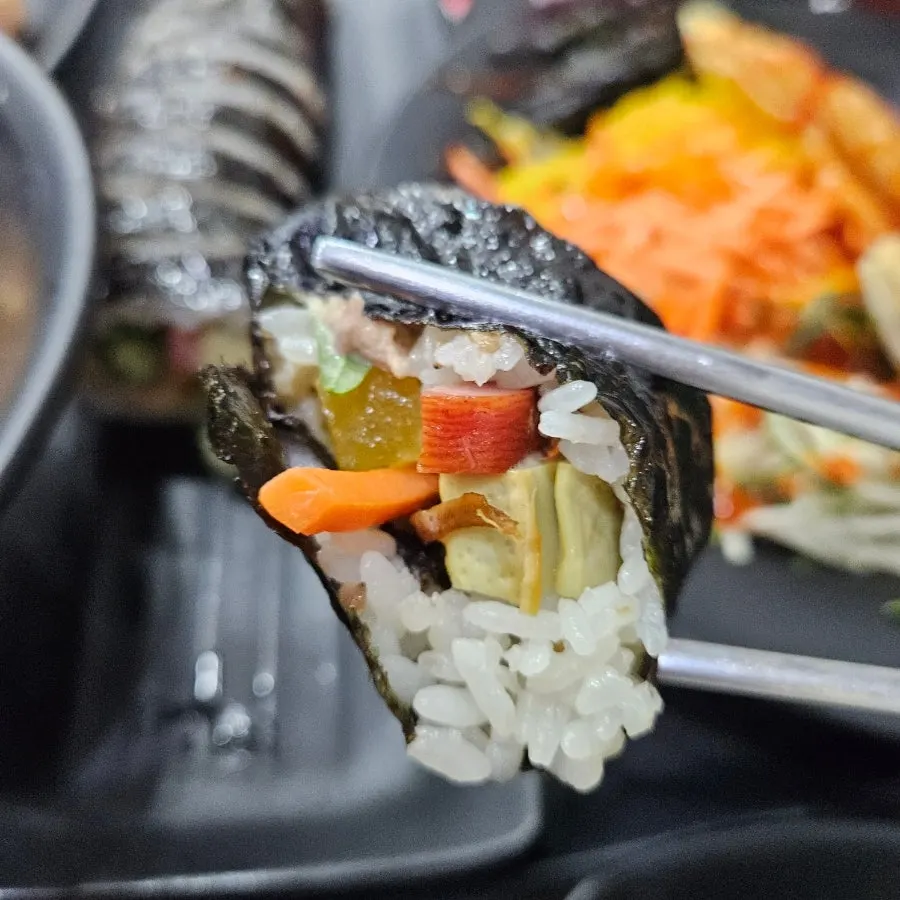A single piece of gimbap packed with filling