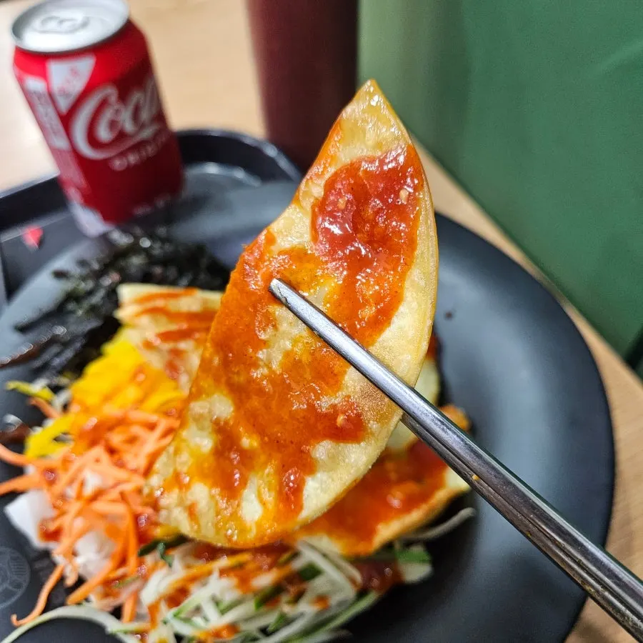 Colorful seasoned vegetables piled on flat mandu