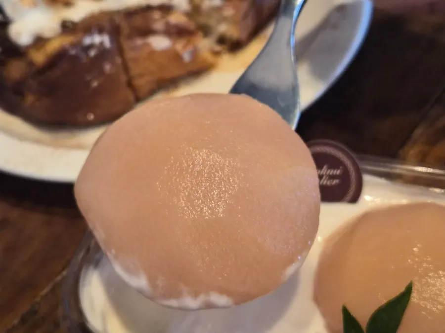 Tiramisu topped with peach compote and garnish