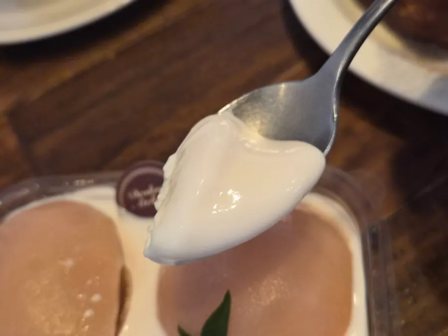 Cross-section of the soft, light white peach tiramisu