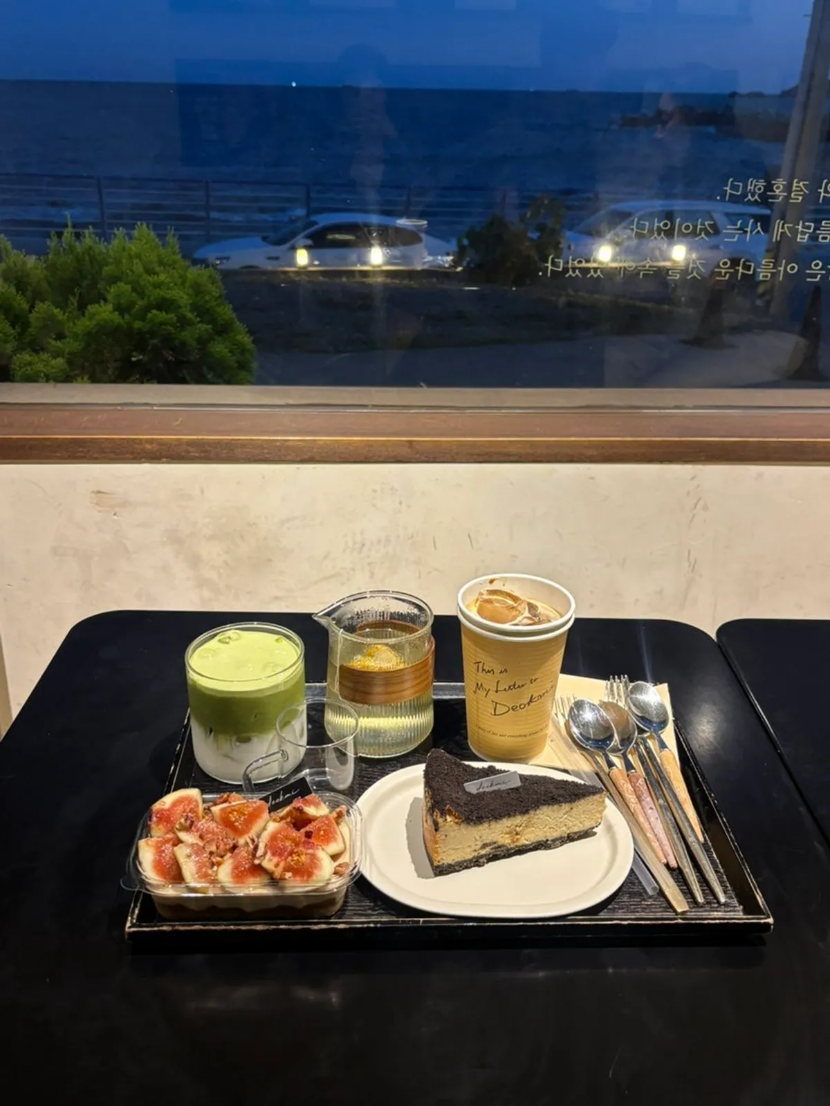 Exterior view of Deokmi Gijang Branch, an ocean-view café on Donganhaean-gil in Gijang