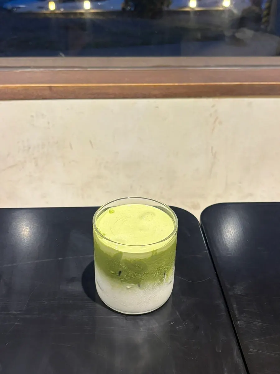 Matcha latte topped with matcha cream at Deokmi Gijang Branch