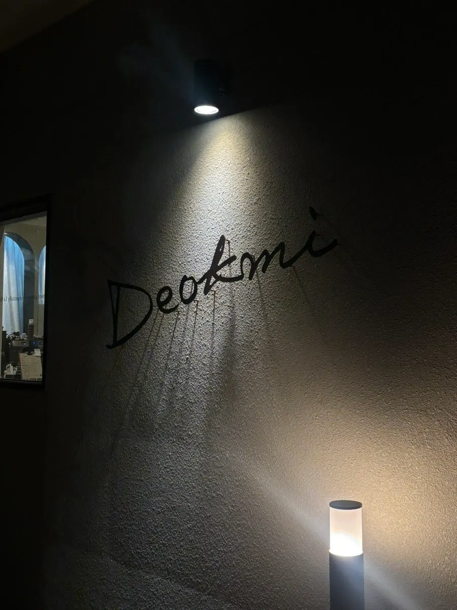 Exterior of Deokmi Gijang Branch lit up at night