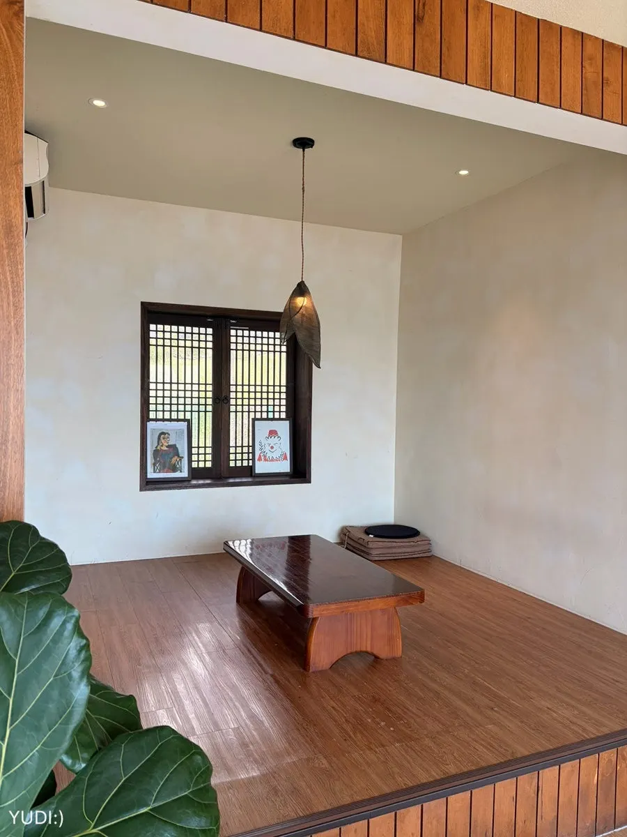 White-toned interior of Deokmi Gijang Branch's annex