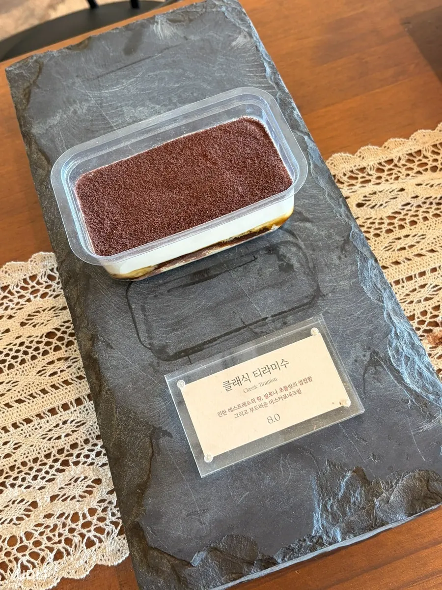 Close-up of the dessert showcase at Deokmi Gijang Branch