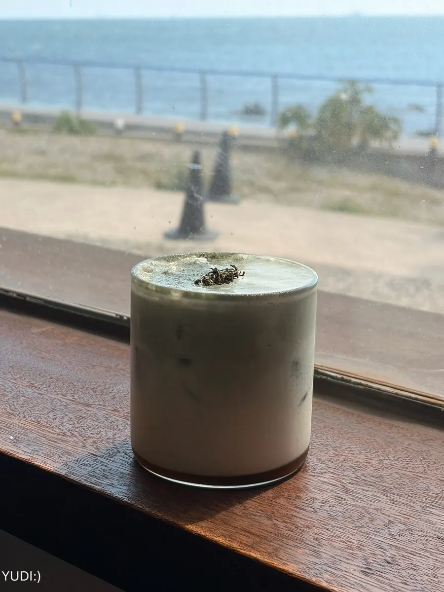 Signature mugwort latte and desserts on the table at Deokmi Gijang Branch