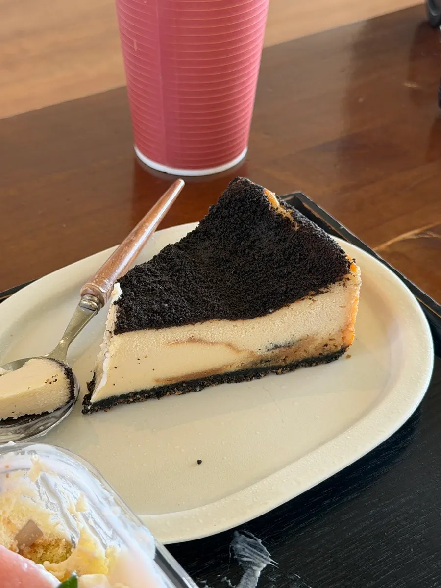 Cross-section of the Oreo cheesecake cut with a fork