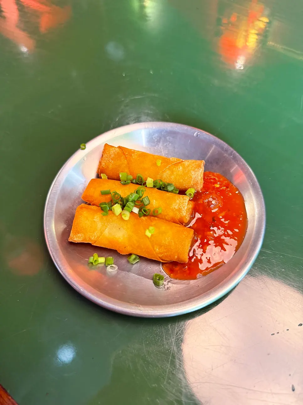 Crunchy seasonal cucumber salad and complimentary spring rolls